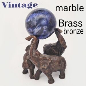 Vintage 1990s brass or bronze elephants with real marple sphere